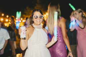 Bride celebrating at colorful wedding party